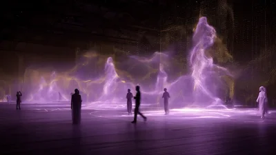 People Walking Through Interactive Light Art Installation