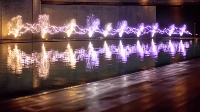 Illuminated Water Fountain Display In Dark Indoor Pool