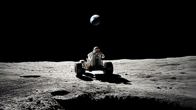 Astronaut Driving Lunar Rover On The Moon Surface