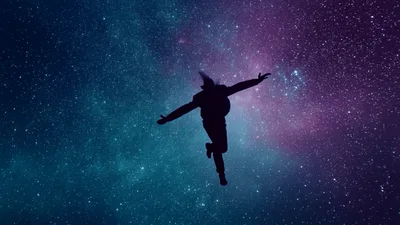Silhouette Of A Person Floating In Deep Space