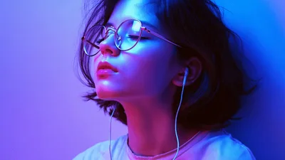 Young Woman Listening To Music With Eyes Closed