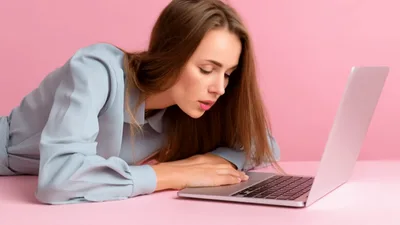 Tired Young Woman Waking Up From Desk Nap