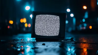 Vintage Television Displaying Static Noise On Wet Street