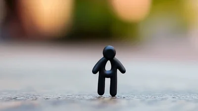 Small Black Clay Figure Standing Upright