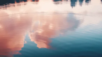 Gentle Ripples On A Calm Lake At Sunset