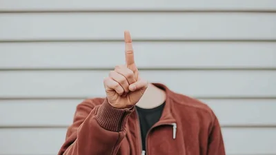 Person Without Head Making Hand Gestures