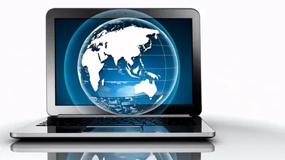 Digital Globe Rotating on Laptop Screen