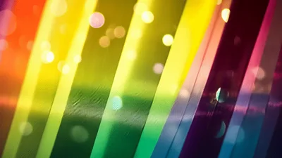 Abstract Rainbow Background With Floating Bokeh Light Particles