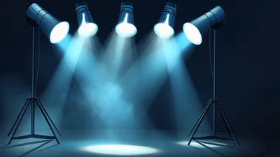 Four Studio Spotlights Illuminating A Dark Stage With Fog