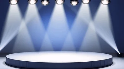 Empty Circular Stage With Overhead Spotlight Beams