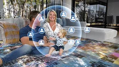 Family Sitting On Rug With Digital Social Network Overlay