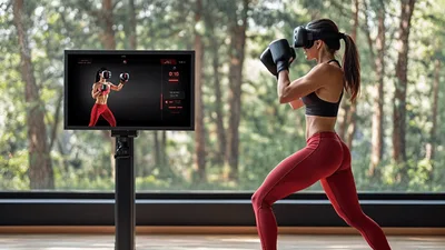 Woman Practicing Virtual Reality Boxing Workout In Home Gym