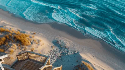 Aerial View Of Beach House Deck And Ocean Waves