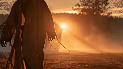 Scarecrow Character Walking And Falling In Golden Sunset