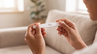 Woman Holding A Positive Pregnancy Test
