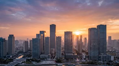 Aerial View of Modern City Skyline at Sunset
