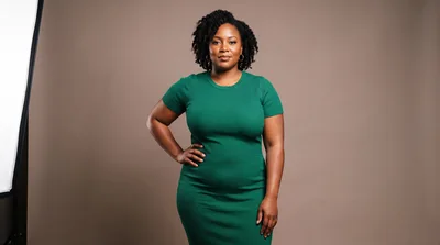 Professional Portrait Of A Confident Woman In Green Dress