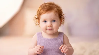 Adorable Baby With Red Hair And Blue Eyes