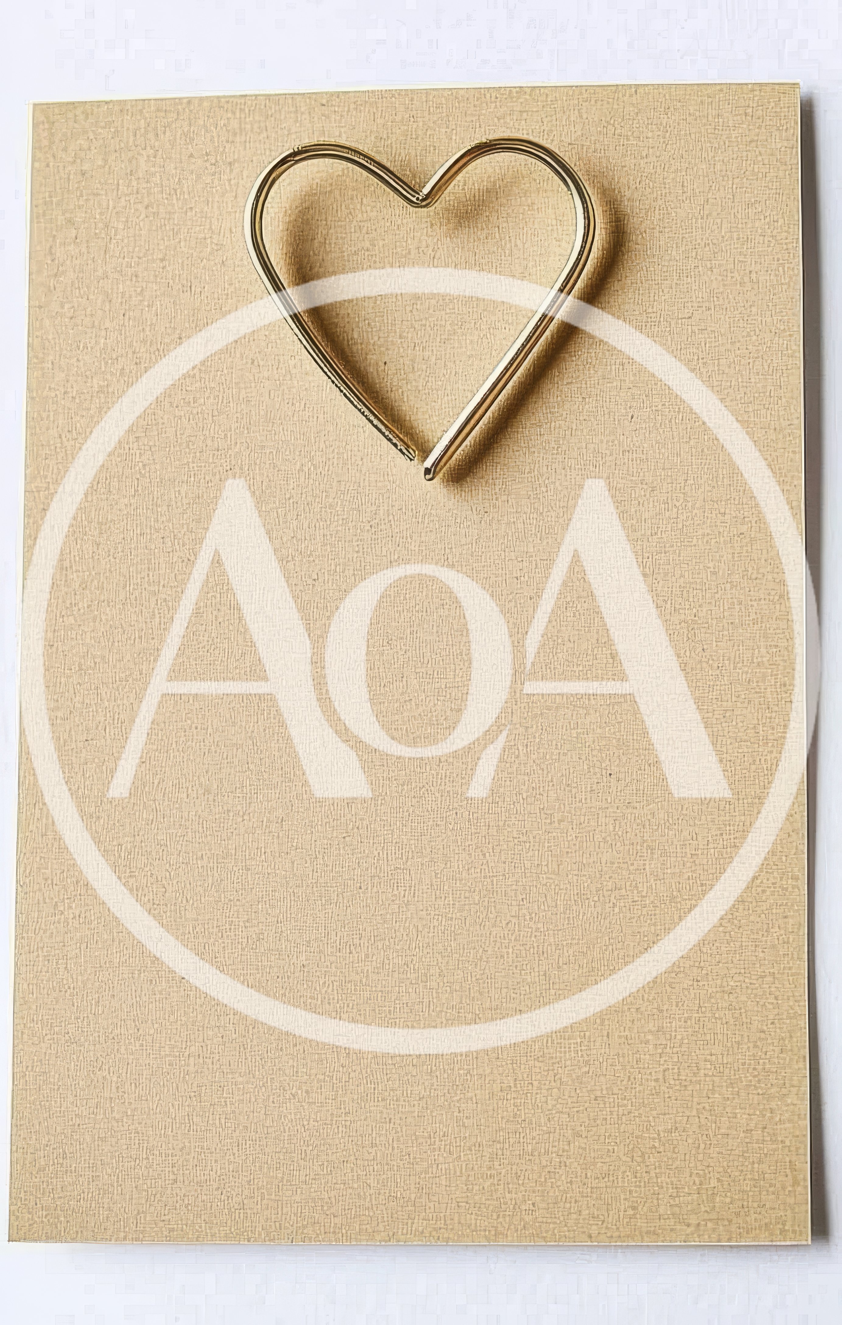 Gold Heart Shape On Textured Beige Background