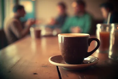 Coffee Cup On A Wooden Table In A Cafe