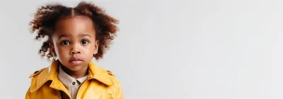Portrait of a Young Child in a Yellow Jacket