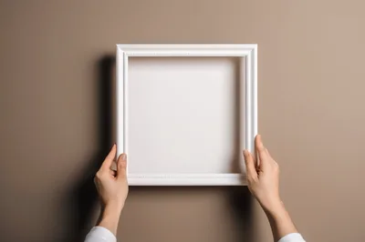 Hands Holding A Blank White Picture Frame