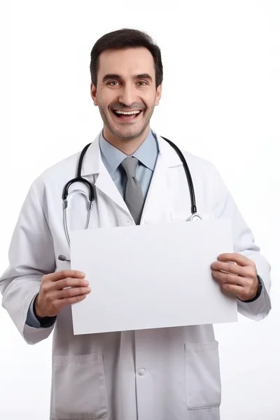 Smiling Male Doctor Holding Blank White Sign