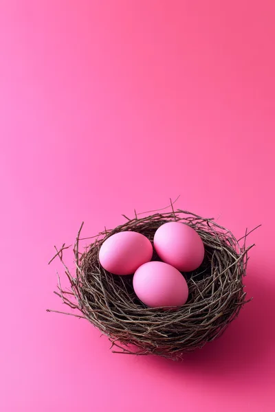 Three Pink Easter Eggs In A Twig Nest