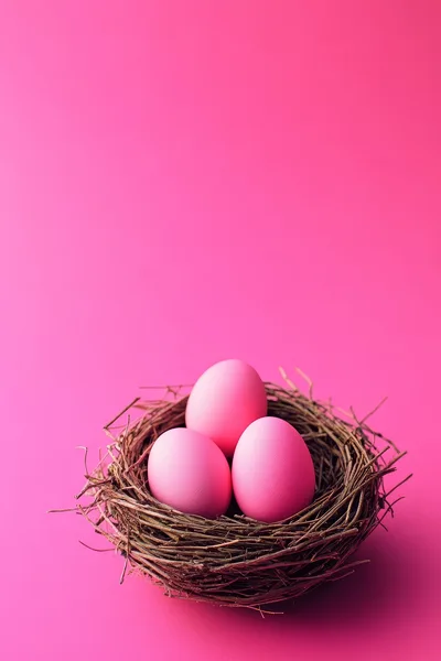 Three Pink Easter Eggs In A Twig Nest