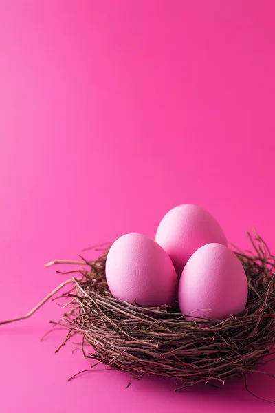Three Pink Easter Eggs In A Twig Nest