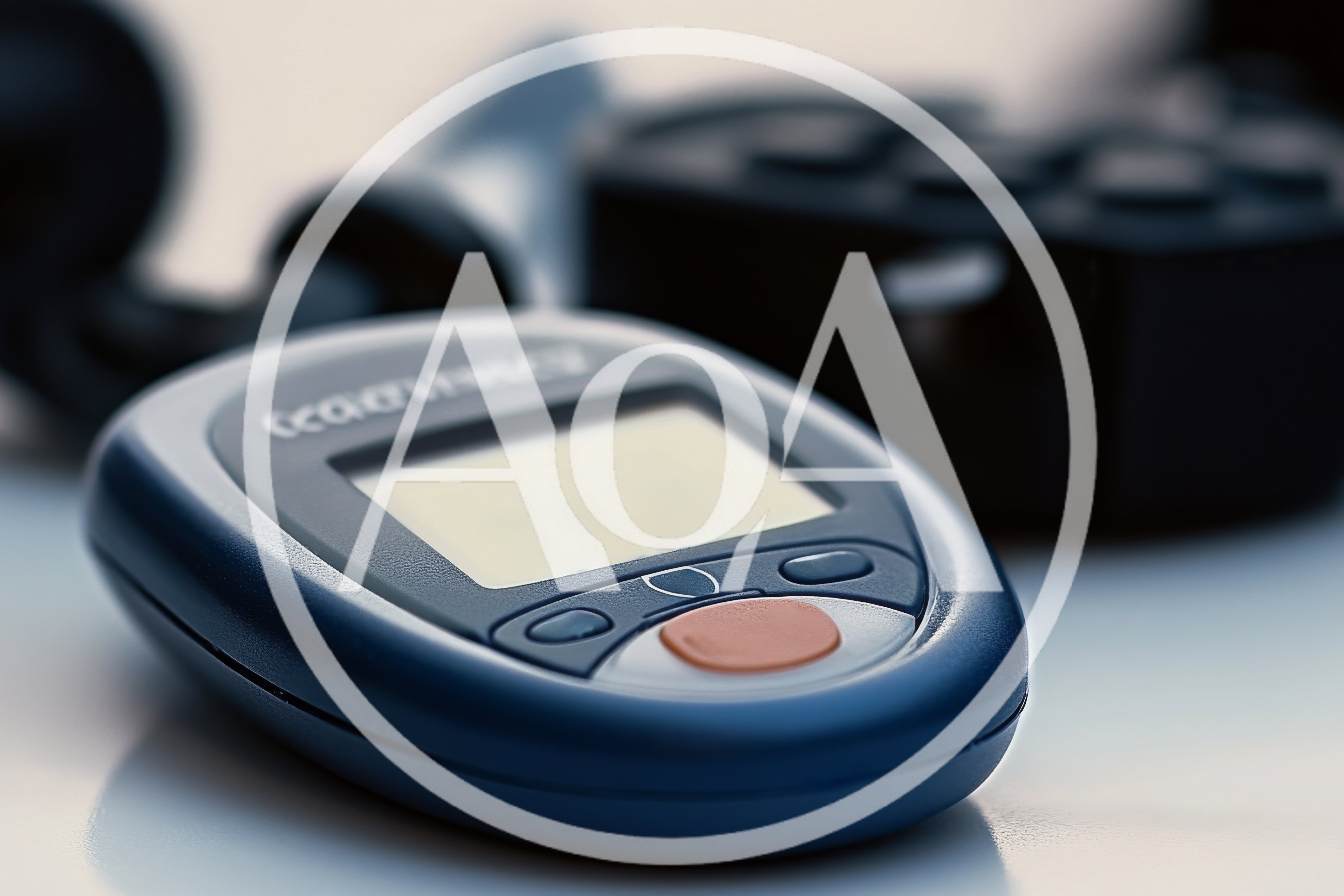 Digital Blood Glucose Meter On A White Surface