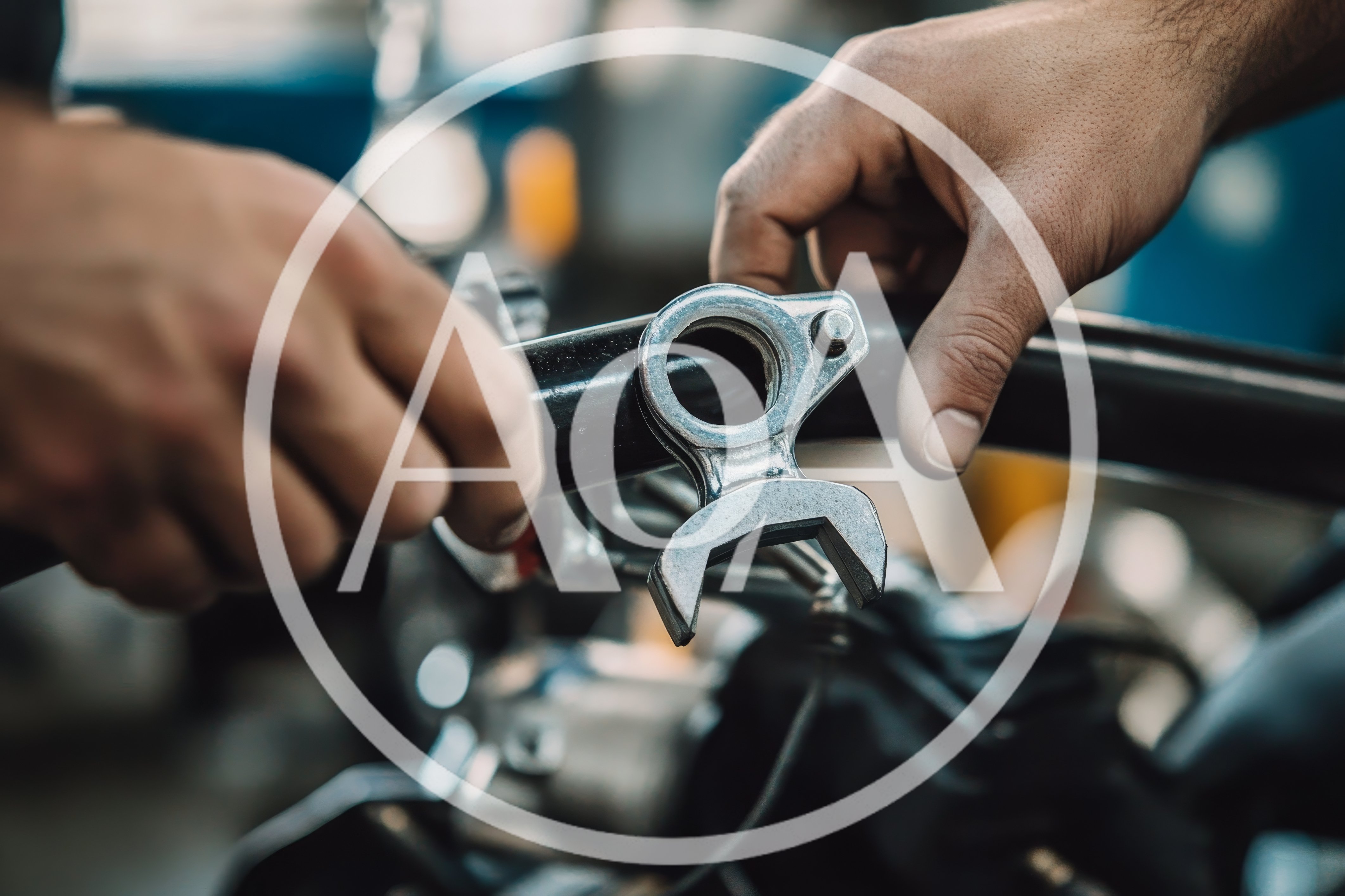 Mechanic Adjusting Motorcycle Handlebar Components In Workshop