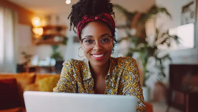Young Woman Working On Laptop At Home
