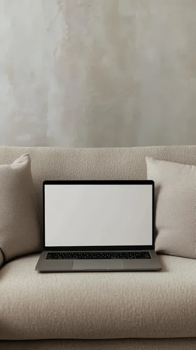 Laptop With Blank Screen On A Cozy Sofa