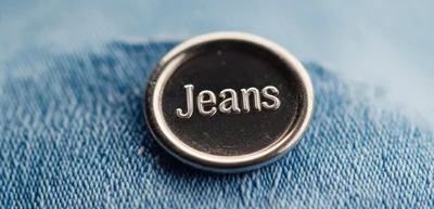 Typewriter Key With The Word Jeans On Denim Fabric