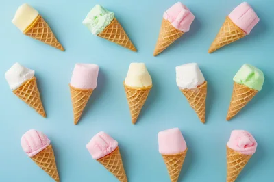 Marshmallow Ice Cream Cones Pattern on Blue Background