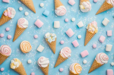 Ice Cream Cones With Marshmallows On Blue Background