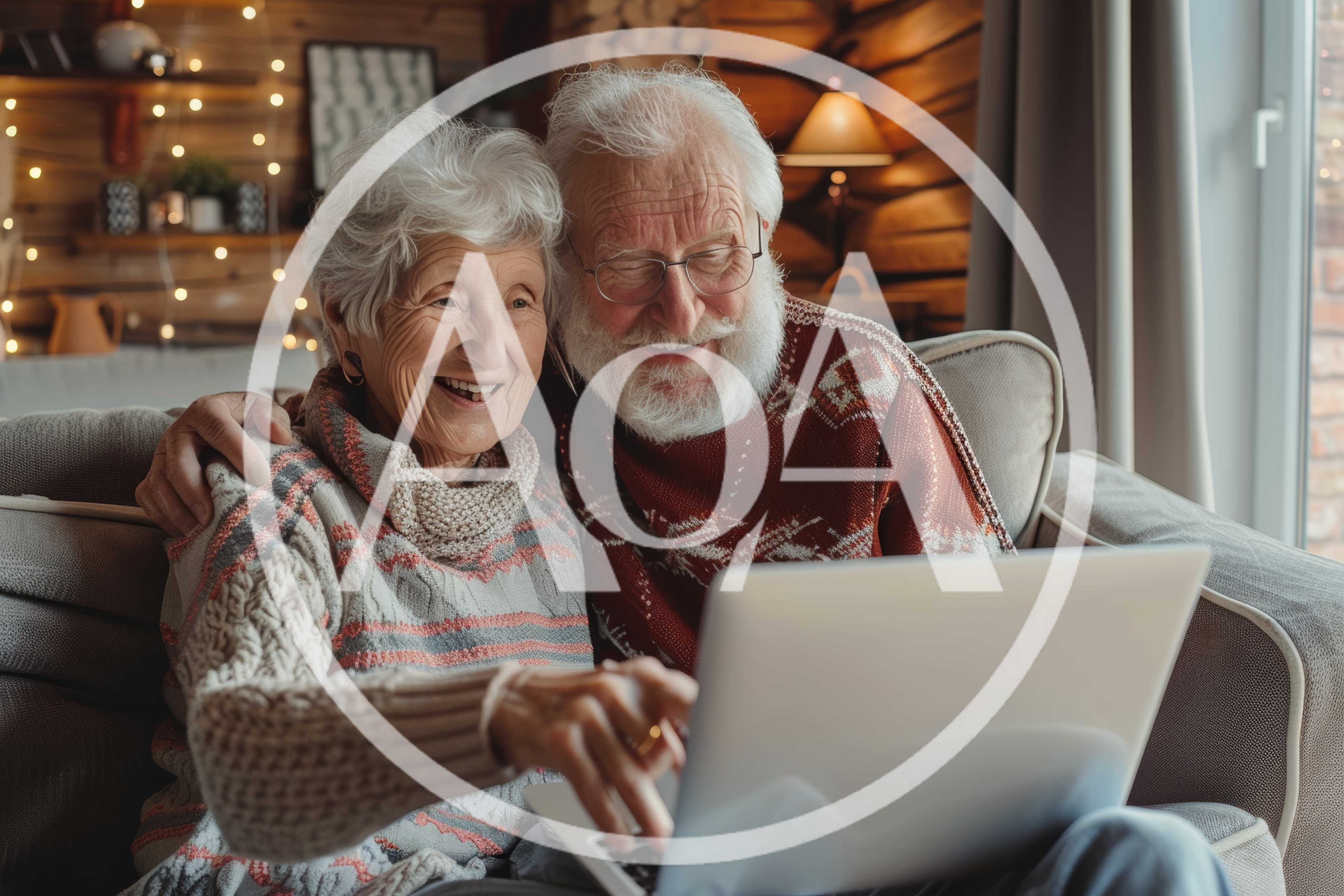 Happy Elderly Couple Using Laptop Together