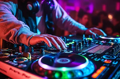 DJ Hands Mixing Music on Professional Controller