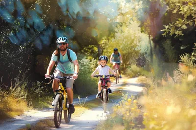 Family Cycling Together On A Sunny Forest Trail