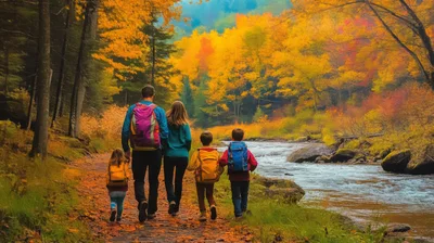 Family Hiking Together Along A Scenic Autumn River