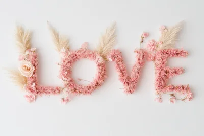 Floral Love Text Arrangement on White Background