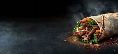 Steaming Beef Burrito Wrap On Dark Textured Surface