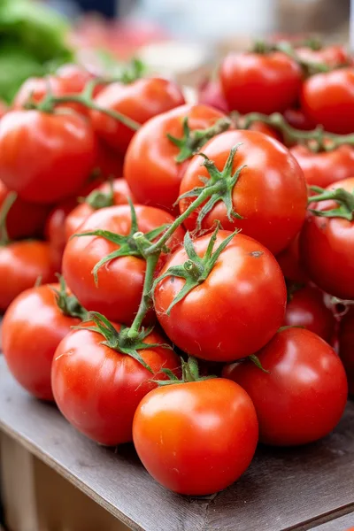Fresh Red Tomatoes On The Vine At Market