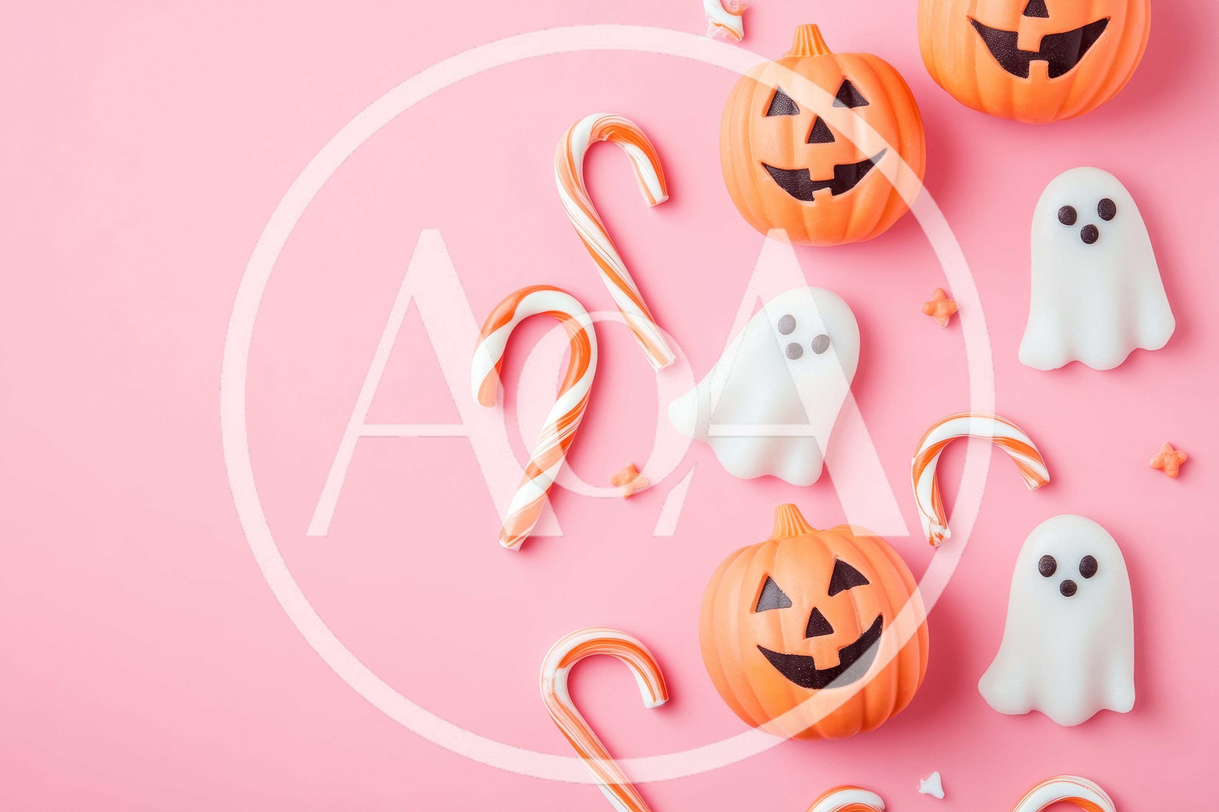 Halloween Candy Decorations on Pink Background