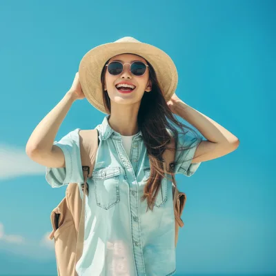 Happy Young Woman Wearing Hat And Sunglasses Outdoors
