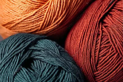 Close Up Of Three Colorful Yarn Skeins