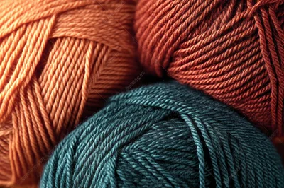 Three Skeins Of Colorful Wool Yarn
