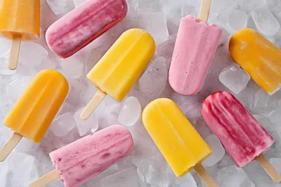 Assorted Fruit Popsicles On A Bed Of Ice