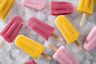 Assorted Fruit Popsicles On A Bed Of Ice